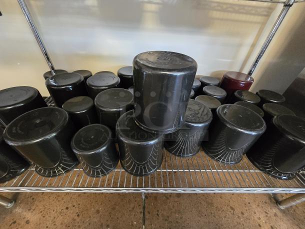 Cambro round inserts, assorted sizes, black plastic, set of 30. Used condition, stackable storage solution.
