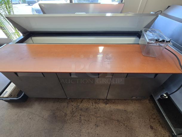 LIKE NEW!! True TSSU-72-18 72 3/8" 3 Door Refrigerated Sandwich Prep Table, 115 Volts	7.2 Amps	1 Phase. IN PERFECT WORKING ORDER! S/N: 3657137 - Image 1 of 2