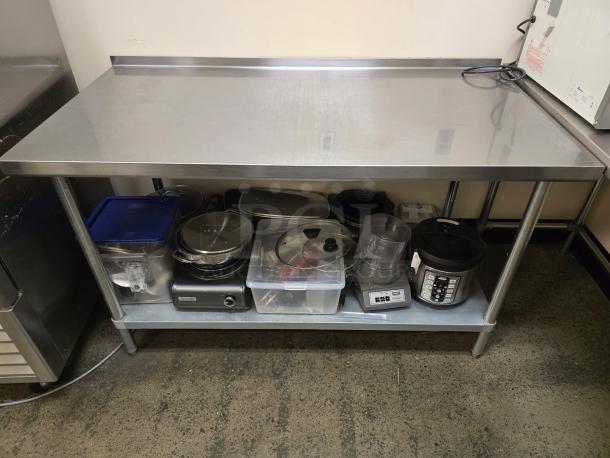 Allstrong 60"x30" stainless steel table with 2" backsplash and galvanized undershelf. Used condition.