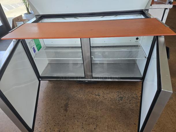True TSSU-60-16-HC refrigerated sandwich prep table, 60 3/8", 2 doors, oversized cutting board, perfect condition.