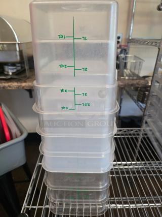 Set of seven 4qt Cambro food containers, clear plastic, stackable, with measurement markings, used condition.