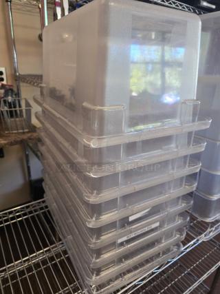 Stack of Carlisle 5 Gallon food containers on shelves, clear plastic, excellent condition. 8 containers included per bid.