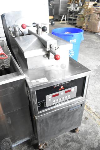Henny Penny 500C Stainless Steel Commercial Floor Style Electric Powered Pressure Fryer on Commercial Casters. 208 Volts, 3 Phase.