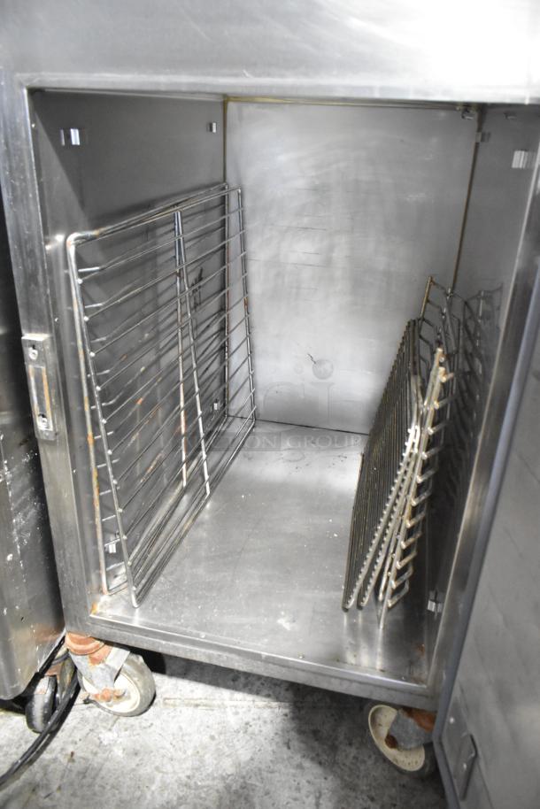 Alto Shaam 1000-UP stainless steel heated holding cabinet, commercial casters, racks included, 120V, 1 phase, used condition.