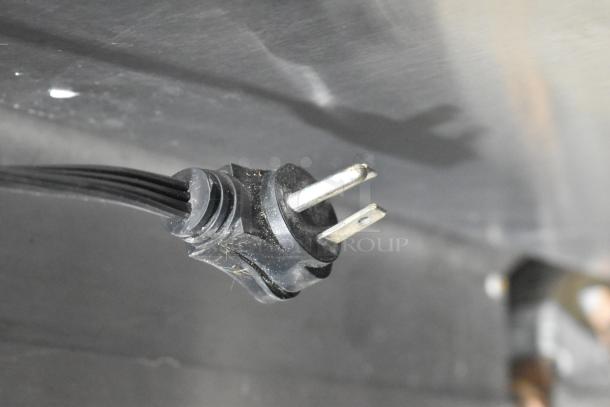 Close-up of power plug for a General Electric GE GTE18GSHBRSS stainless steel cooler, 115 volts, 1 phase.