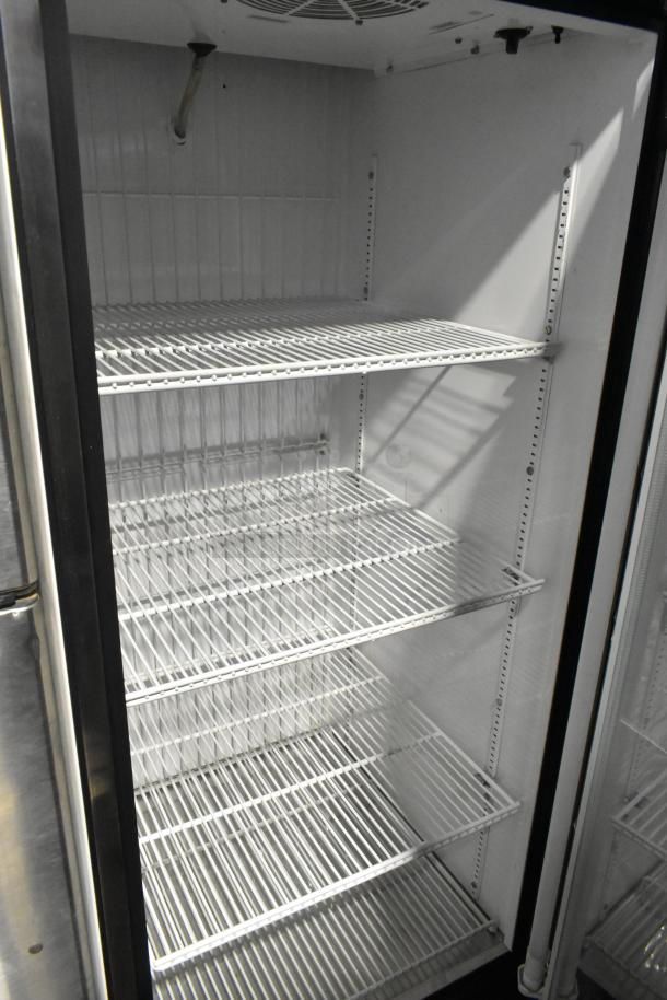True GDM-23F single door freezer merchandiser with poly coated racks, metal exterior, 115 volts, 1 phase.