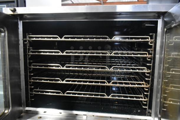 Southbend SilverStar stainless steel convection oven, view-through doors, metal racks, thermostatic controls; commercial use.