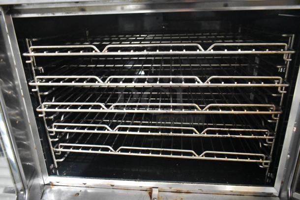 Southbend SilverStar stainless steel commercial convection oven with metal racks, view-through doors, and thermostatic controls.
