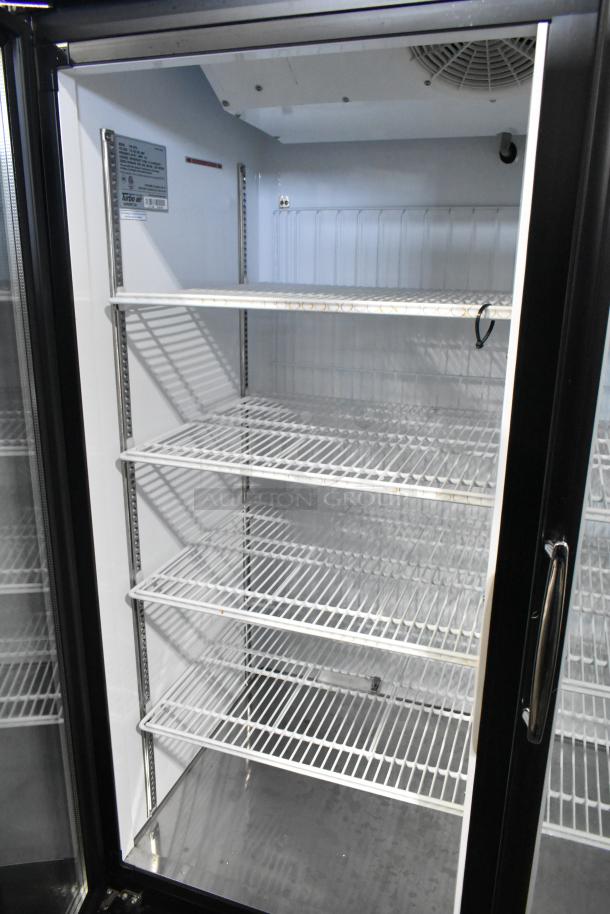 Turbo Air TGF-72FB commercial freezer, 3-door, metal, poly-coated racks, 115/220-240V, 1 phase, excellent condition.