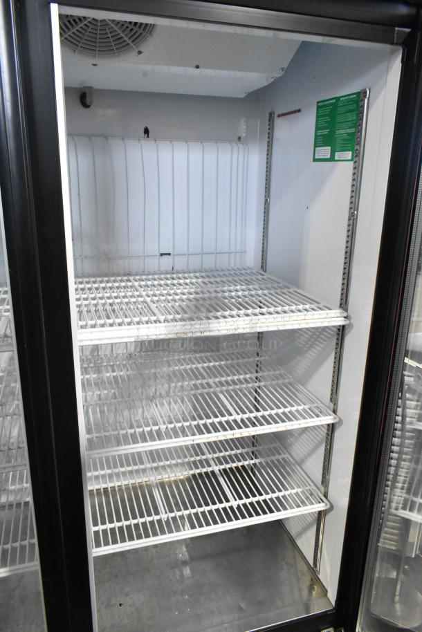 Turbo Air TGF-72FB 3-door freezer merchandiser with poly-coated racks, clean interior, 115/220-240V, 1 phase.