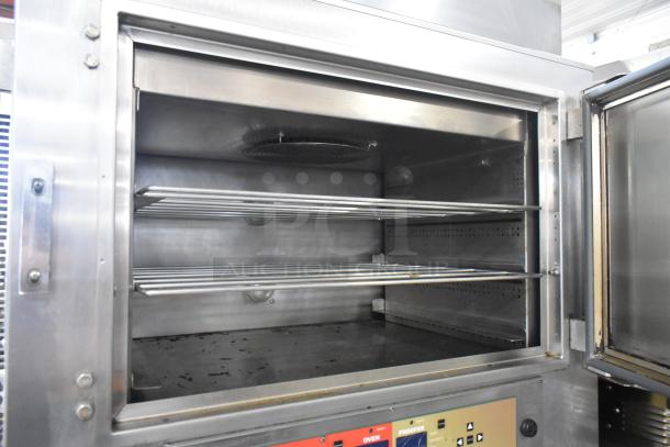 Nu Vu SUB-123P stainless steel commercial floor oven proofer, 208 volts, 3 phase, with casters. Interior racks, visible controls.