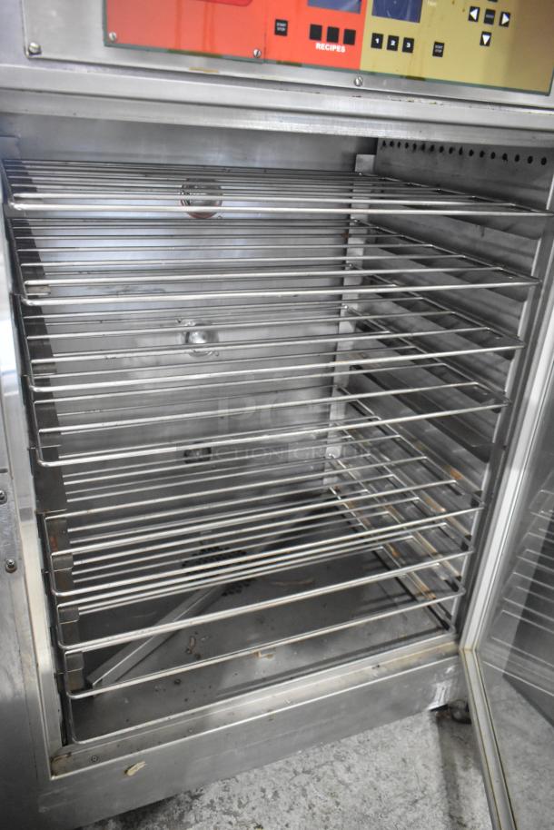 Nu Vu SUB-123P stainless steel commercial oven proofer, floor style, on casters, 208V, 3 phase, interior racks visible.