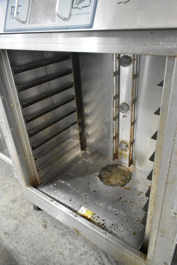 Duke TSC-6/18 stainless steel commercial oven proofer, used condition, visible rust and wear, on commercial casters.