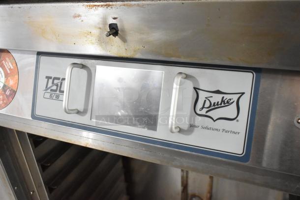 Duke TSC-6/18 stainless steel oven proofer on commercial casters, 208V, 3 phase, visible wear, brand label shown.