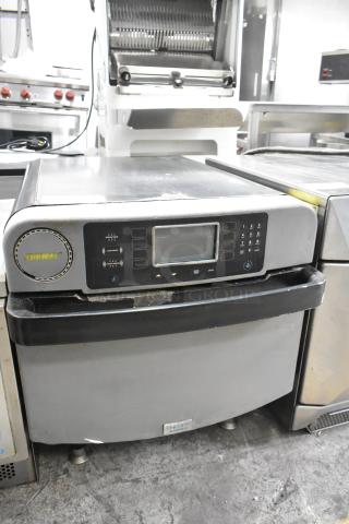 Turbochef ENC metal countertop rapid cook oven, electric, 208/240V, used, visible control panel, sturdy legs.