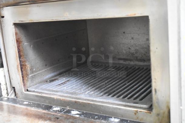 Turbochef NGC stainless steel rapid cook oven, electric powered. Visible wear inside, suitable for commercial use. Model NGC.