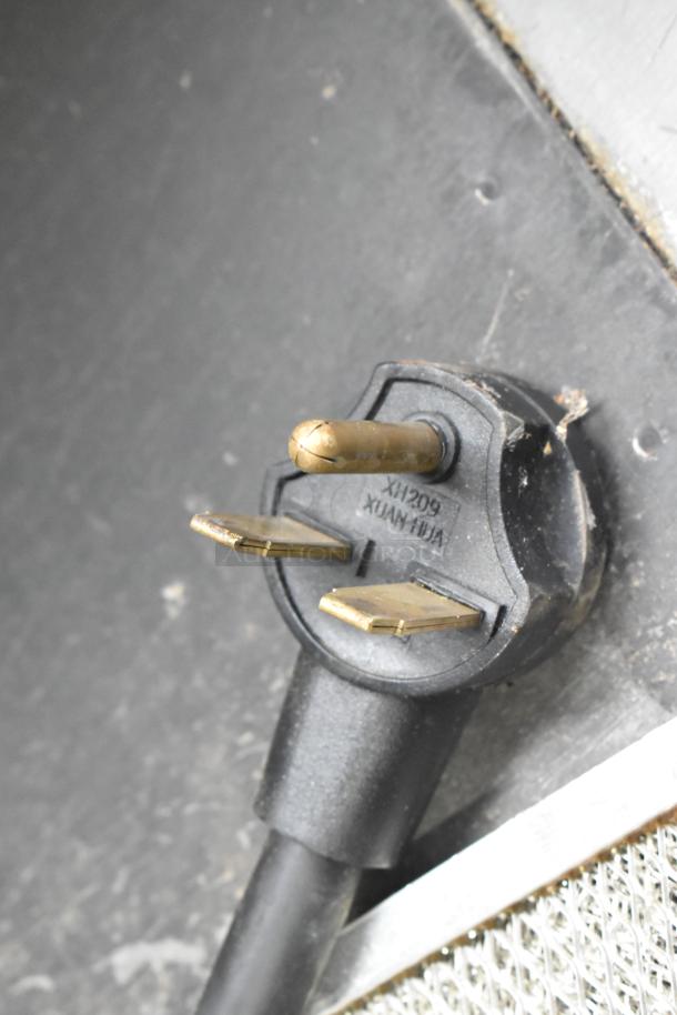 Power plug of Turbochef Encore 2 commercial rapid cook oven, 208/230-240 Volts, 1 Phase. Close-up of plug prongs.