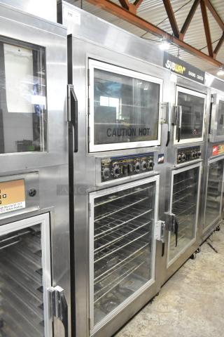 Nu Vu SUB-123 stainless steel oven proofer, 208V, 3 phase, on commercial casters, multiple glass doors, control dials visible.