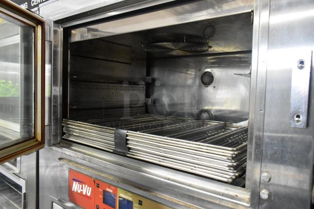 Nu Vu SUB-123P stainless steel commercial oven proofer on casters, 208V, 1 phase. Clean interior, stack of racks inside.