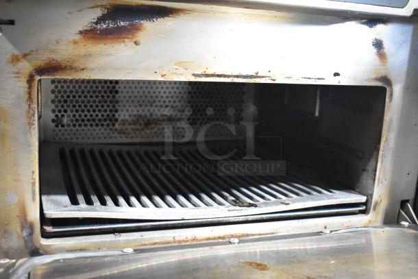 Turbochef ENC commercial countertop rapid cook oven, metal exterior, 208/240 volts, showing signs of use with interior wear.
