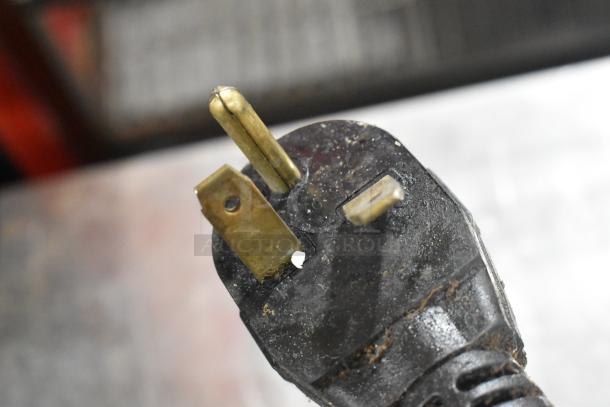 Close-up of a plug from the Merrychef eikon e4 rapid cook oven, showing its 3-prong design for 208/240V, 1 Phase power.