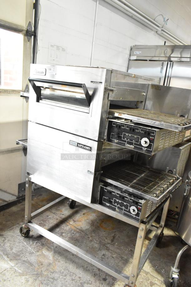 2 Lincoln Impinger 1132 Stainless Steel Commercial Electric Powered Conveyor Pizza Oven on Commercial Casters. 208 Volts, 3 Phase. 2 Times Your Bid! - Image 1 of 13