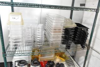 "Tiered lot of assorted poly drop-in bins and trays on shelving, various sizes, stackable design, item tag reads '138 QTY.'"