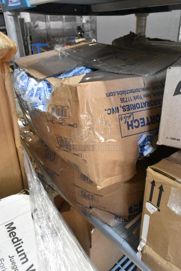 Tiered lot with 3M Red Buffer Pads, Purell Soap Dispenser, Diversey Cleaner. Boxes show wear; labeled 3M and Diversey.