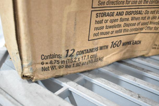 Cardboard box with printed details showing contents: 12 containers with 160 wipes each, 22 lbs net weight.