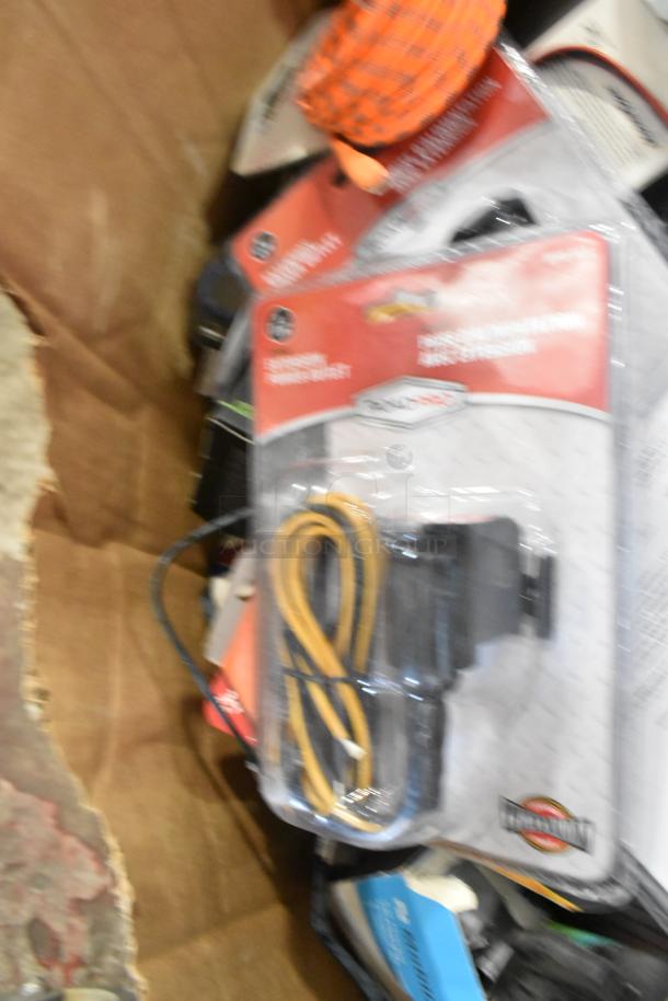 Lot of assorted items including car chargers, packaging of Zebra label rolls, and chargers; various conditions.