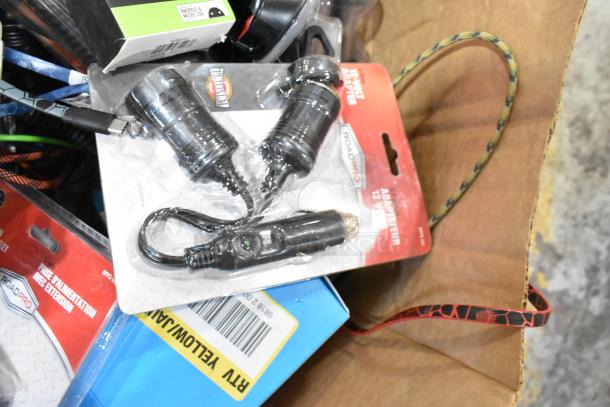 Assorted item lot including RoadPro 12V car chargers, USB cables, and Zebra label rolls. New and packaged.