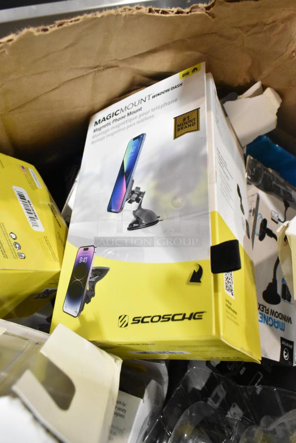 Lot of various items, including Scosche MagicMount phone mounts, mostly new in original packaging, visible wear on boxes.