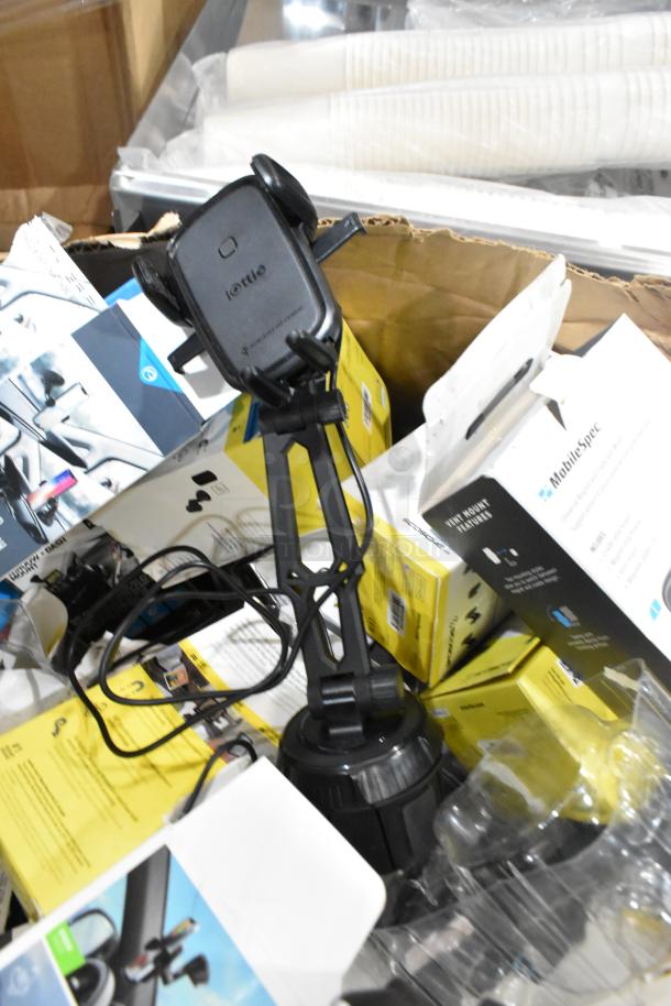 Lot of various items including phone mounts, featuring multiple boxed mounts in mixed condition, including iOttie and MobileSpec brands.
