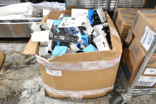 Box of assorted items including phone mounts, slightly damaged packaging, labeled for auction, lot number 147.