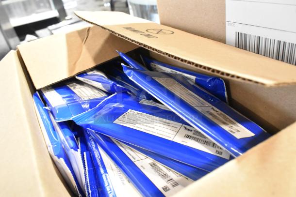 Box with blue packets inside, branded as Purell soap refills. Contains visible labels with text and barcodes.