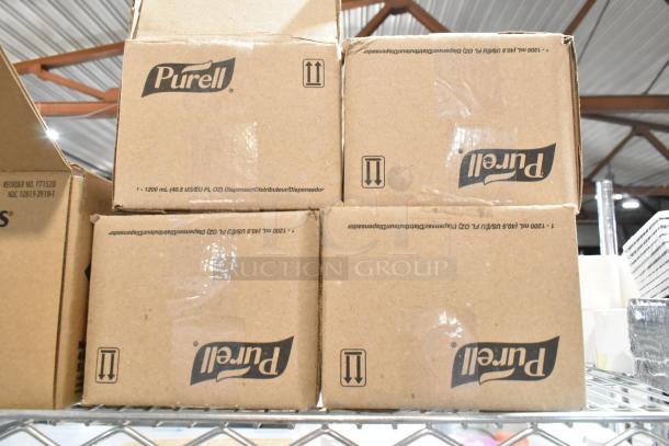 Boxes of Purell soap dispensers on a metal shelf, brand label and model details visible.