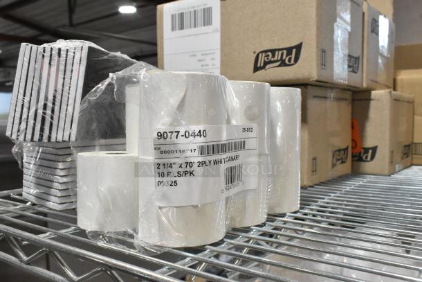 Tiered lot with Pendaflex SureHook box files, Purell soap dispenser, and receipt printer rolls on a metal shelf.