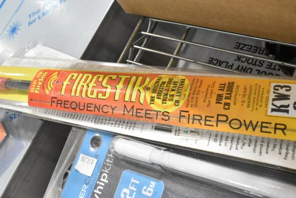 Auction lot featuring a FireStik CB antenna labeled "Frequency Meets FirePower," with warranty details.