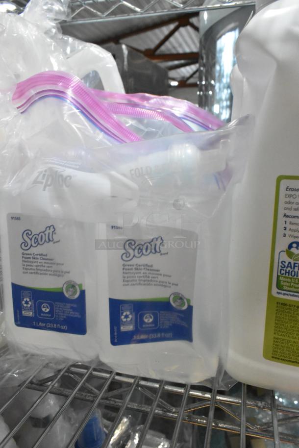 Auction lot with Scott Foam Skin Cleanser bottles and other items in Ziploc bags on metal shelf.
