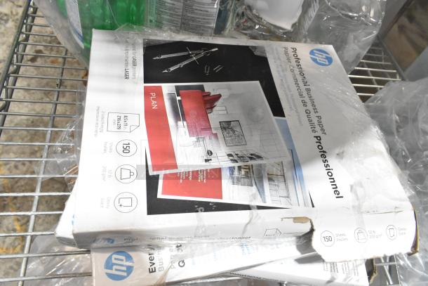 Alt text: HP Professional Business Paper, 8.5x11 inches, 150 sheets, glossy, seen in a tier lot with other items.