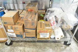 ALL ONE MONEY! Tier lot with Scott dispenser, foam skin cleanser, daily scrub, and various boxed items on metal cart.