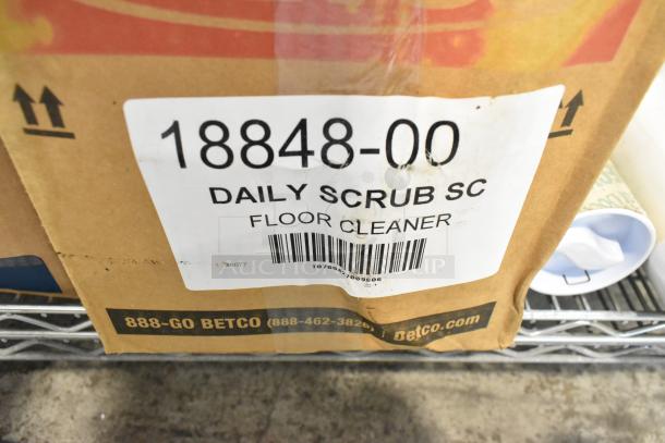 ALL ONE MONEY! tier lot including a Scott dispenser, foam skin cleanser, and daily scrub. Box label reads "18848-00 Daily Scrub SC Floor Cleaner" with Betco contact info.