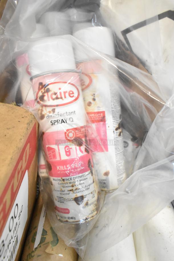Tier lot with various items including Claire Disinfectant Spray Q visible, in plastic packaging, primarily household cleaning products.