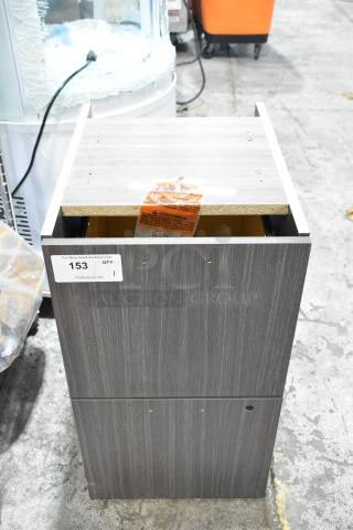 Brand new wood pattern 2-drawer unit with visible scratches and dents. Tag reads "153, QTY 1," indicating auction details.