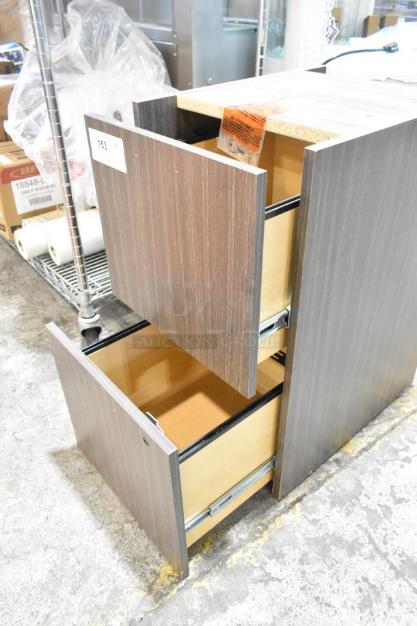 Brand new scratch and dent wood-pattern 2-drawer unit. Features visible minor imperfections. Open drawers shown.