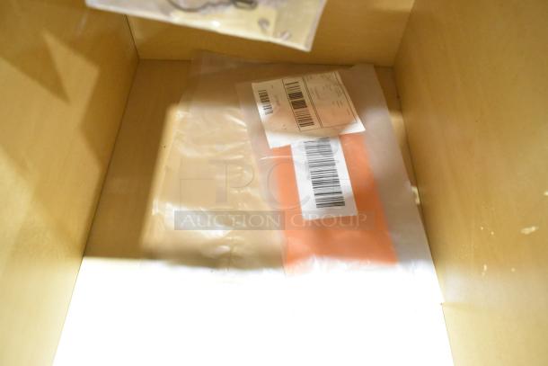 Brand new wood pattern 2-drawer unit with minor scratches; includes packaging materials with barcoded labels.