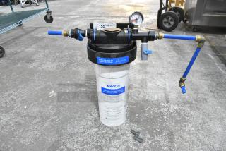 Ecolab Water Filtration System with pressure gauge and blue tubing, featuring Kay water filtration cartridge. Good condition.