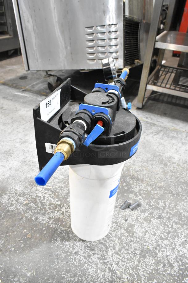 Ecolab water filtration system with blue tubing, pressure gauge, and plastic housing. Appears in used condition.