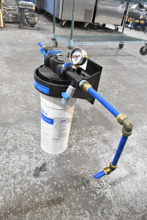 Ecolab Water Filtration System in good condition with gauge, pipes, and connectors; labeled for commercial use.