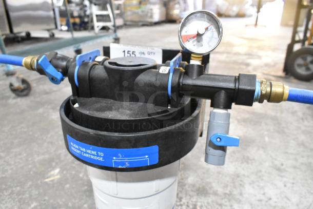 Ecolab water filtration system with gauge and blue valve. Text on label: "Align tab here to insert cartridge." Good condition.